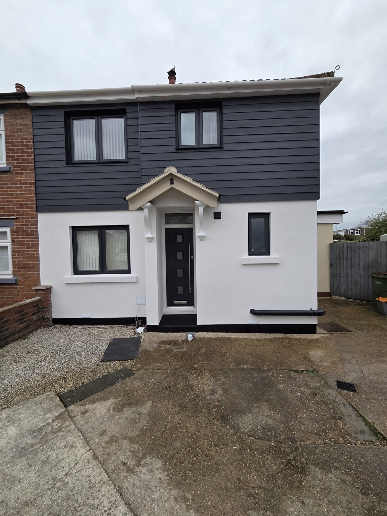 Freshly rendered front elevation with dark cladding detail